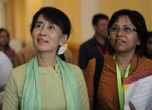 Myanmar opposition leader Aung San Suu Kyi (L), seen here during a break after a lower house parliament session in Naypyidaw, on July 9. Suu Kyi made her historic parliamentary debut, marking a new phase in her near quarter century struggle to bring democracy to her army-dominated homeland