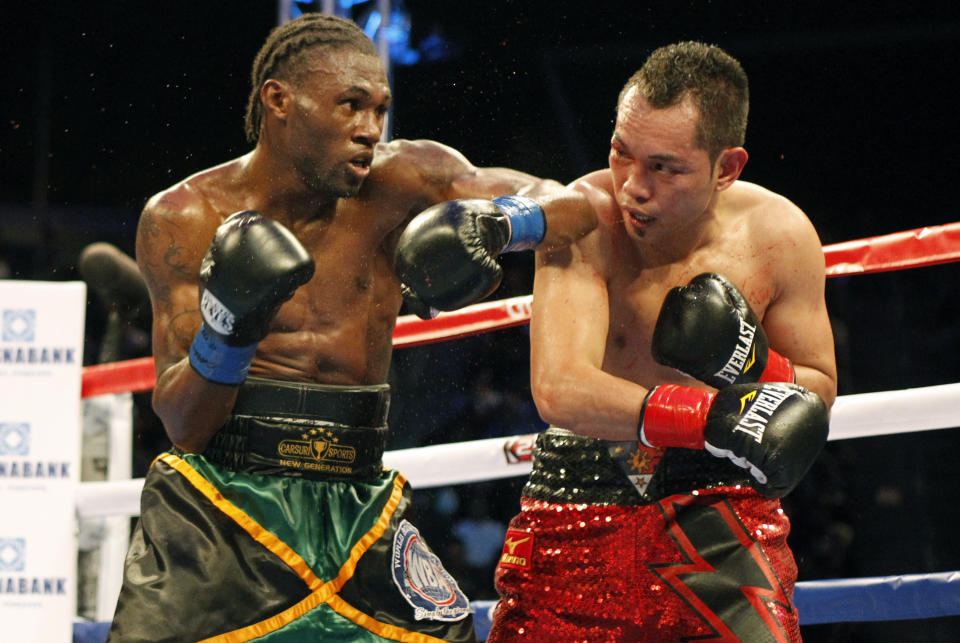 Nicholas Walters, left, battles Nonito Donaire in the second round during a WBA featherweight title boxing fight, Saturday, Oct. 18, 2014, in Carson, Calif. Walters won in the sixth round. (AP Photo/Alex Gallardo)