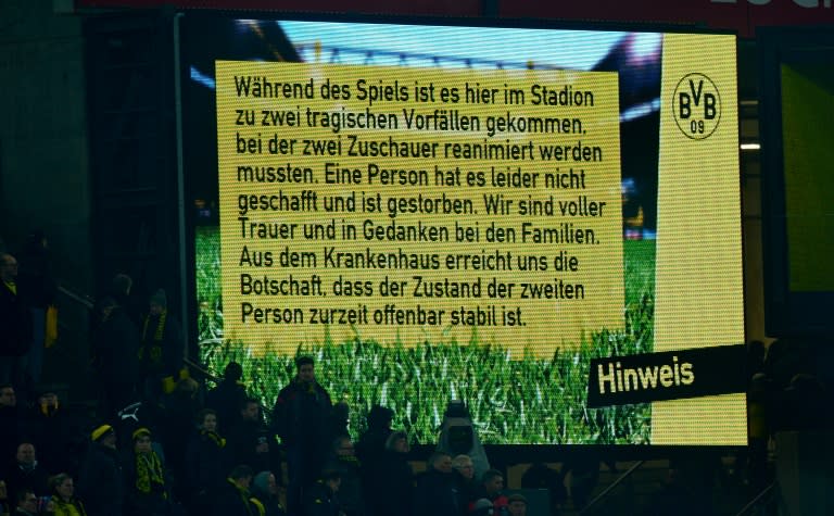 A sign informs of the death of a fan during the German first division Bundesliga football match Borussia Dortmund v 1 FSV Mainz 05 in Dortmund, on March 13, 2016