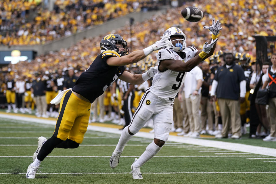 Iowa defensive back Cooper DeJean (3) breaks up a pass intended for Western Michigan wide receiver Kenneth Womack (9) during the first half of an NCAA college football game, Saturday, Sept. 16, 2023, in Iowa City, Iowa. (AP Photo/Charlie Neibergall)