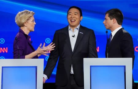 Democratic presidential candidates Warren, Yang and Buttigieg talk during the fourth U.S. Democratic presidential candidates 2020 election debate at Otterbein University in Westerville, Ohio U.S.