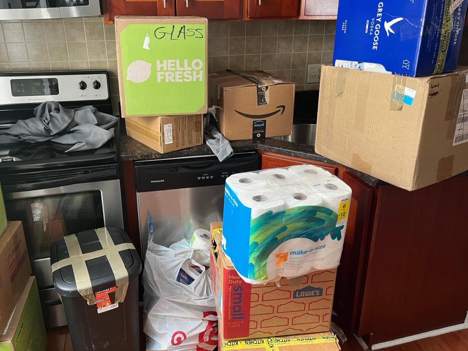 Moving boxes stacked in a kitchen.