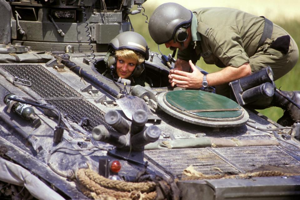 The then princess of Wales in the driving seat of the ‘Striker’ tank, getting instructions from Sgt Chris O’Byrne on Salisbury Plain in 1988 (Ron Bell/PA) (PA Wire)