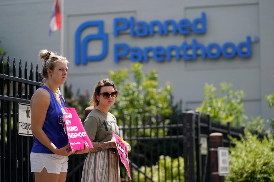 Kendal Underwood, left, and Brittany Nickens protest in support of abortion rights outside Planned Parenthood Friday, June 24, 2022, in St. Louis. Ron Wyden (D-Ore.) said on Feb. 13, 2024 that an anti-abortion campaign targeted people visited 600 Planned Parenthood locations around the country.