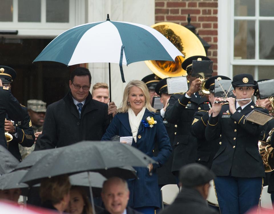 Lt. Gov. Bethany A. Hall-Long and her husband, Dana, walk out into the rain for an inauguration ceremony at Legislative Hall in Dover in 2017.