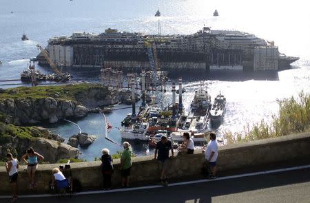 The Costa Concordia cruise liner is seen during its refloat operation at Giglio harbour July 23, 2014. REUTERS/ Alessandro Bianchi