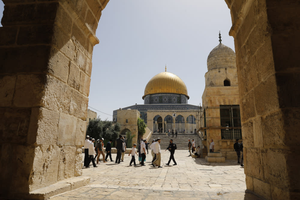 Israeli security forces escort a group of Jewish settlers visiting the Al-Aqsa Mosque compound in the Old City of Jerusalem June 2, 2019. — AFP pic