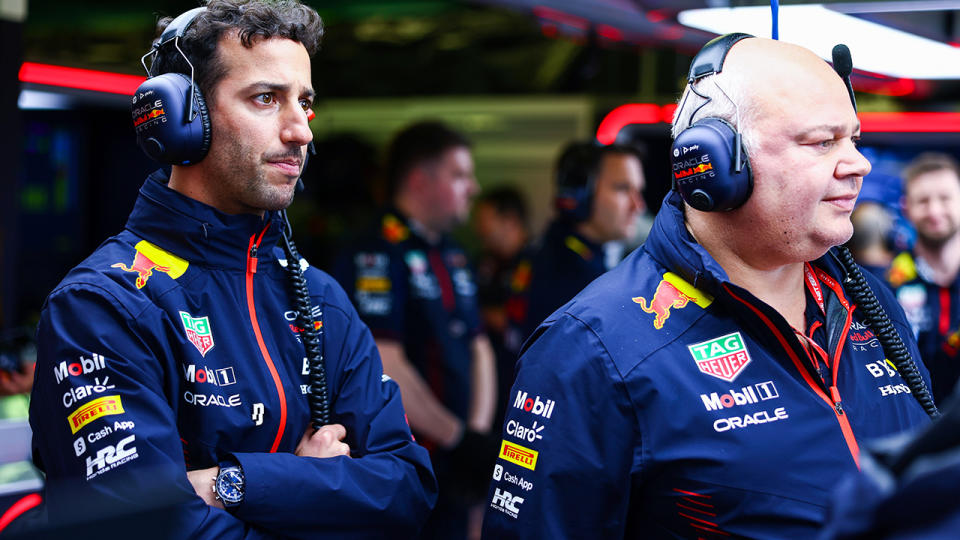 Daniel Ricciardo looks on from the Red Bull garage. 