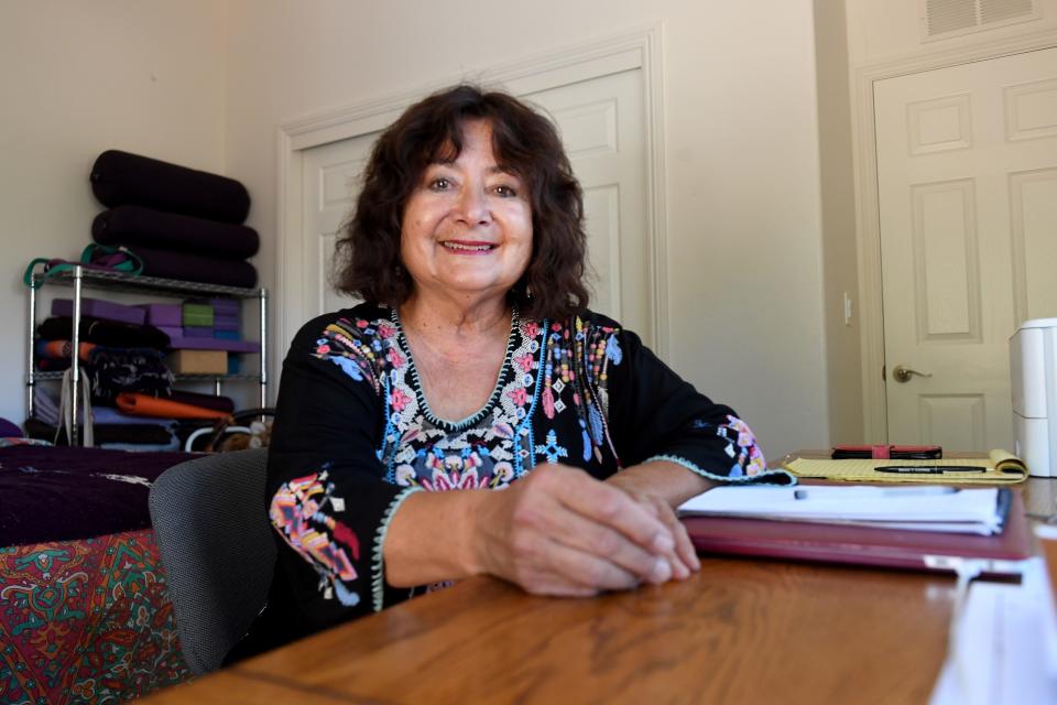 Ojai councilwoman Suza Francina sits at her desk in her new rental home in Ojai earlier this month. She searched for months for a place after her previous rental was sold.