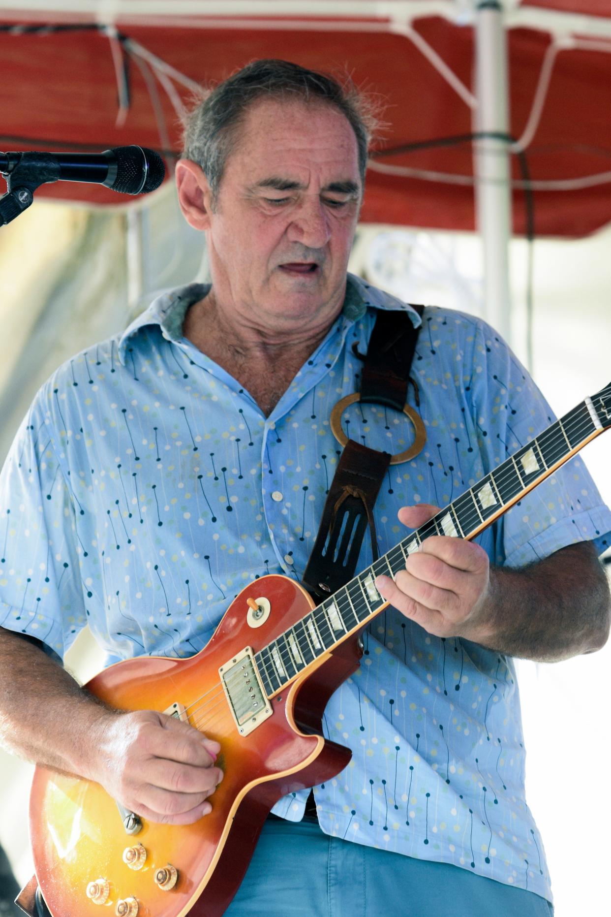 Greg Poulos (seen here performing at Big Top Brewing Company in 2020), a Sarasota native and guitarist who played with musicians including blues legend Freddie King, died April 29. He was 70.