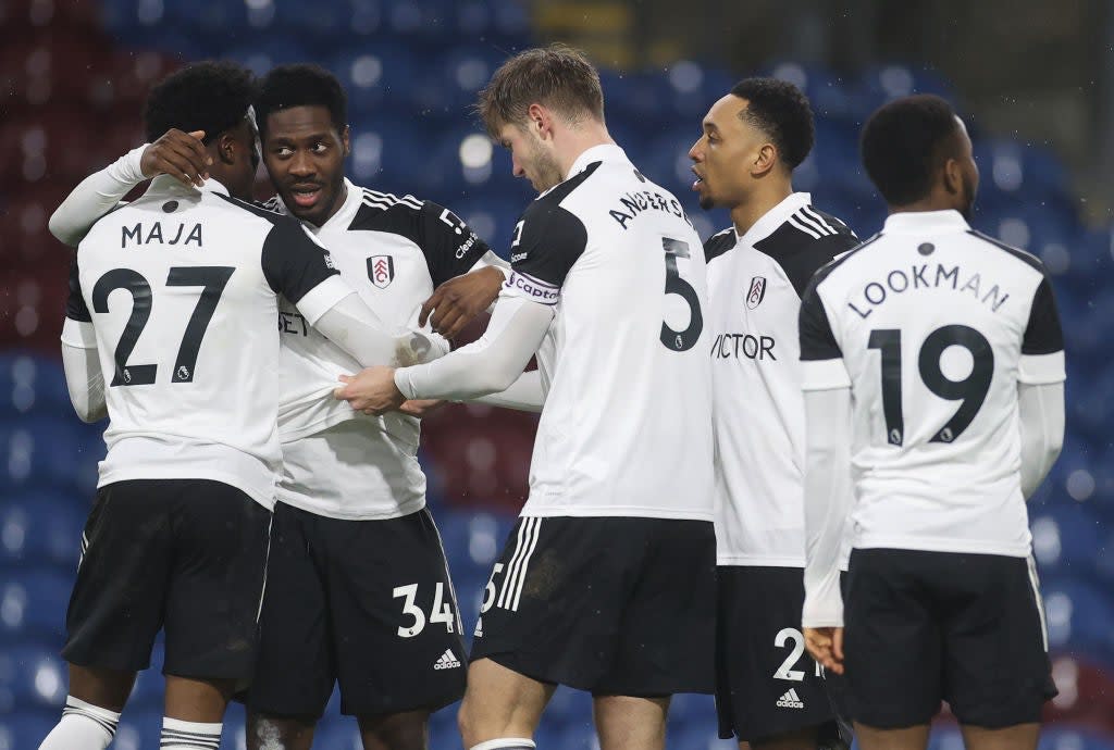 <p>Ola Aina of Fulham celebrates with Josh Maja, Joachim Andersen and Kenny Tete</p> (Getty)