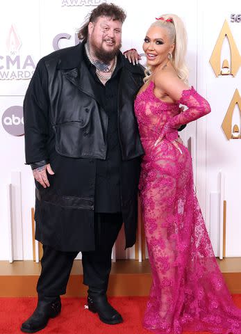 <p>Taylor Hill/FilmMagic</p> Jelly Roll and Bunnie Xo attend the CMA Awards in November 2022.