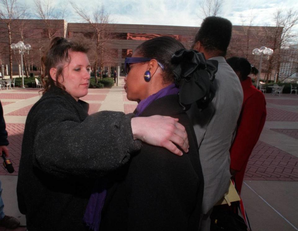 Lisa Burrell, left, comforts Dee Sumpter, mother of Henry Wallace murder victim Shawna Hawk, outside the courthouse in Charlotte on Jan. 7, 1997. Burrell’s cousin Brandi Henderson was also murdered by Wallace. Sumpter has long claimed that Wallace would have been caught sooner if his victims had been from more affluent parts of Charlotte.
