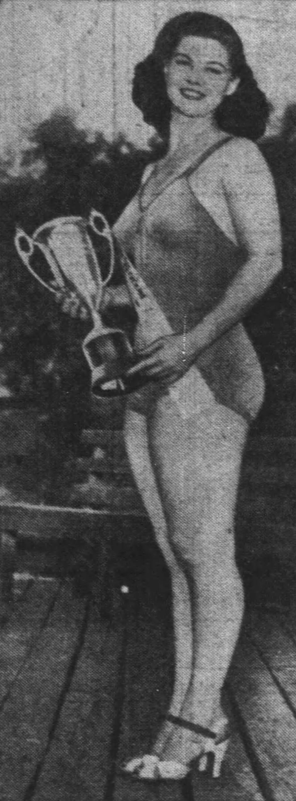 Dorothy Streicher, whose stage name was Kiki Arnold, holds a trophy in 1939 after being crowned the B.F. Goodrich queen at a United Rubber Workers of America picnic at Geauga Lake Park.