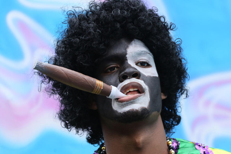 <p>A member of the Krewe of Zulu walk through New Orleans, Louisiana on February 28, 2017. New Orleans is celebrating Fat Tuesday, the last day of Mardi Gras. (Dan Anderson/EPA) </p>