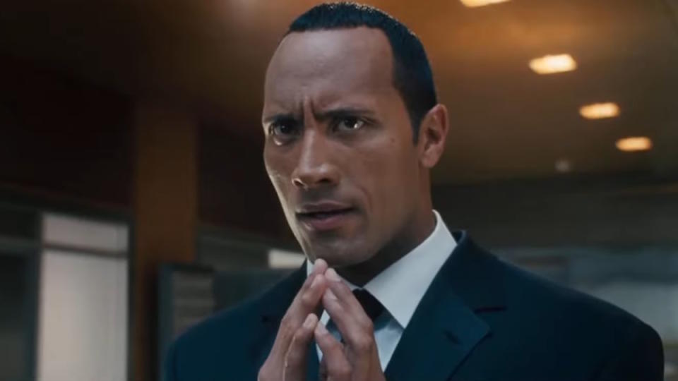 Dwayne Johnson wears a suit and looks nervous in Southland Tales