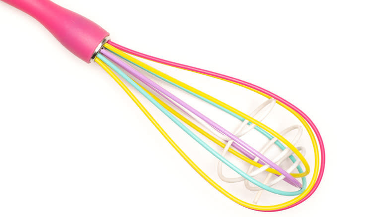 colorful 'double' whisk against white background