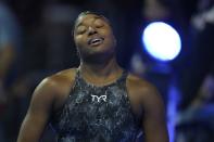 Simone Manuel reacts after the women's 50 freestyle during wave 2 of the U.S. Olympic Swim Trials on Sunday, June 20, 2021, in Omaha, Neb. (AP Photo/Charlie Neibergall)