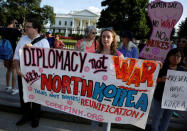 Protesters call for peaceful negotiations with North Korea during a vigil in front of the White House in Washington, U.S., August 9, 2017. REUTERS/Joshua Roberts