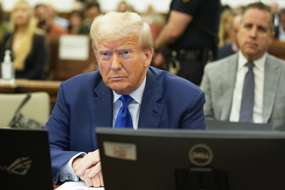 Former President Donald Trump, waits for the continuation of his civil business fraud trial at New York Supreme Court, Wednesday, Oct. 25, 2023, in New York. (AP Photo/Seth Wenig, POOL)