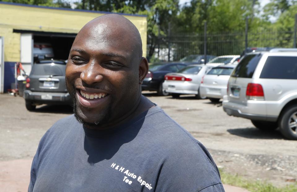 In this July 23, 2019, photo, auto repairman Terrance Holmes is interviewed in Detroit. When Barack Obama was on the ballot in 2008 and 2012, there was no question that Holmes would vote for the first black president. But as he helped fix cars at a repair shop on Detroit's west side, he recalled his ambivalence about the 2016 campaign. He hasn't paid much attention to the early Democratic primary and didn't know that two high-profile black candidates are running. But he vowed to help vote President Donald Trump out of office in 2020, regardless of which Democrat emerges as his challenger. (AP Photo/Carlos Osorio)
