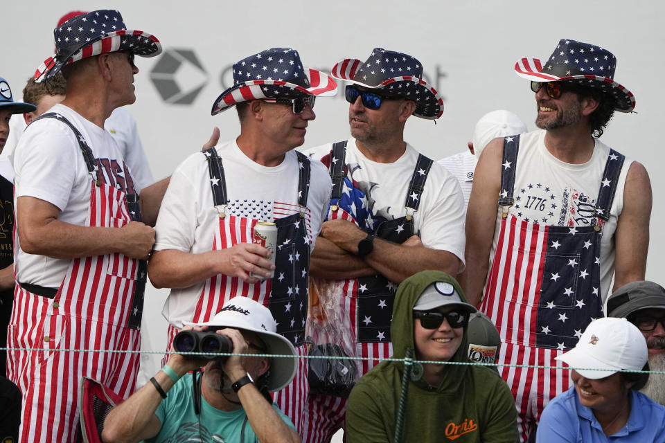 Fans watch play during a singles match between the USA team and the International team at the Presidents Cup golf tournament at the Quail Hollow Club, Sunday, Sept. 25, 2022, in Charlotte, N.C. Team USA won the Presidents Cup golf tournament. (AP Photo/Chris Carlson)