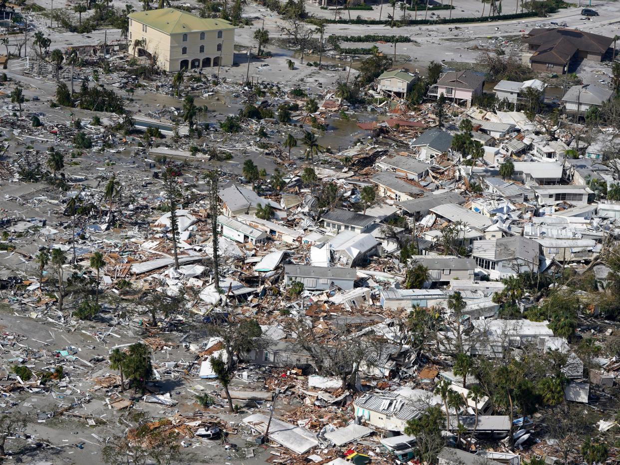 Damaged homes and debris are shown in the aftermath of Hurricane Ian, Thursday, Sept. 29, 2022, in Fort Myers, Fla.