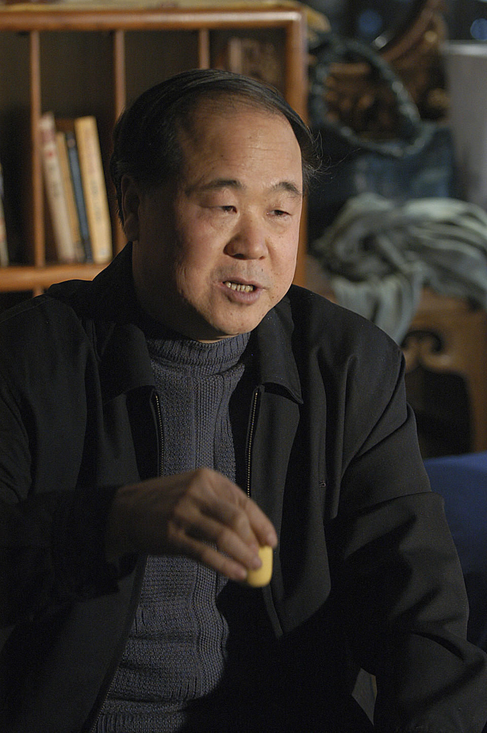 In this photo taken on Tuesday, Dec. 27, 2005, Chinese writer Mo Yan reacts during an interview in Beijing, China. Mo won the Nobel Prize in literature on Thursday, Oct. 11, 2012, a somewhat unexpected choice by a prize committee that has favored European authors in recent years. (AP Photo) CHINA OUT