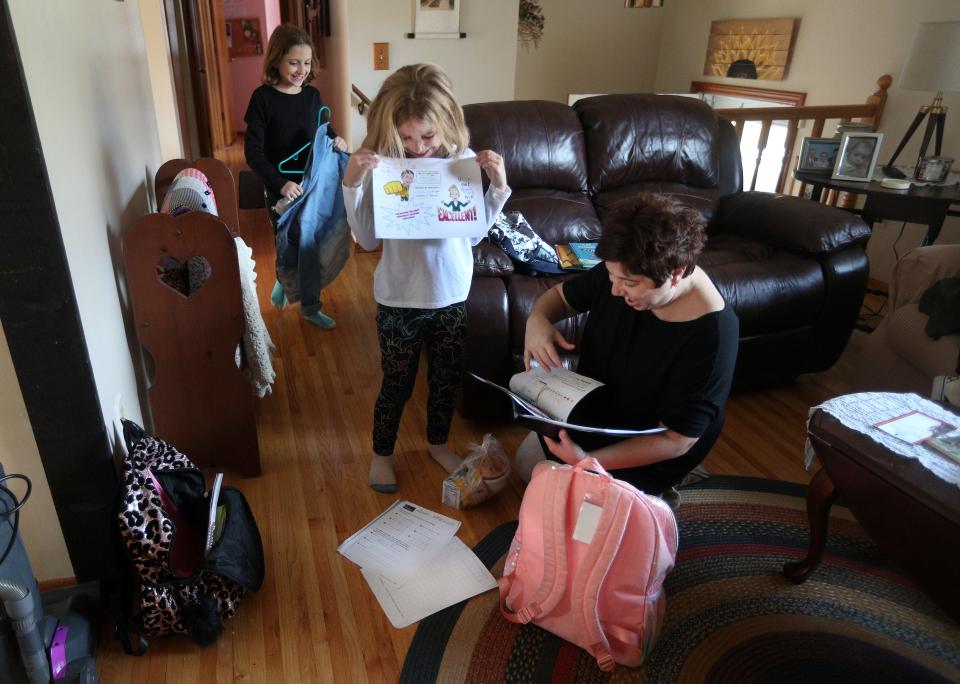 Sara Walrath of Webster and her daughters, Charlotte and Sammie, pictured here in 2020, had a routine every day after school at Plank Road Elementary North. They would come home and wash their hands and go through their backpacks and school work.