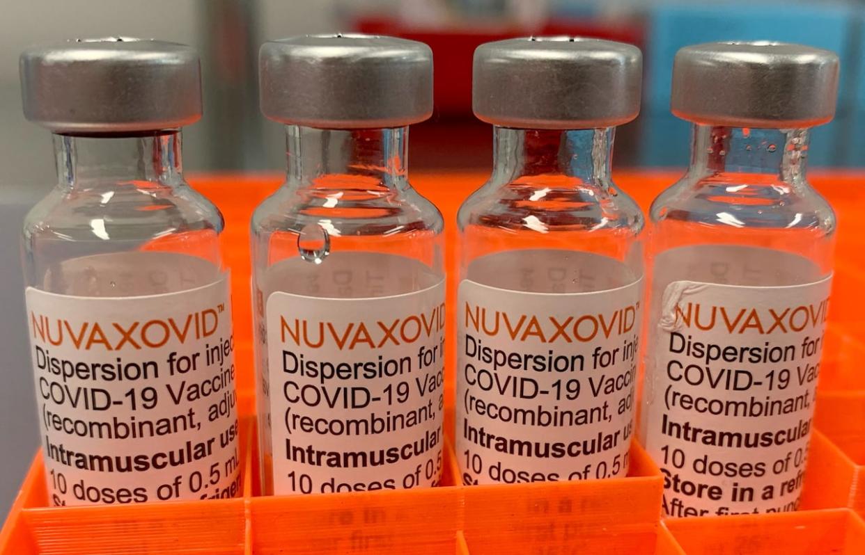 Four vials with the Nuvaxovid COVID-19 vaccine from Novavax are pictured in Saabruecken, Germany, in February 2022.      (Frank Simon/Reuters - image credit)