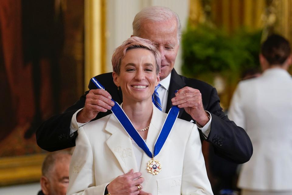 Megan Rapinoe receives her Presidential Medal of Freedom from President Joe Biden.