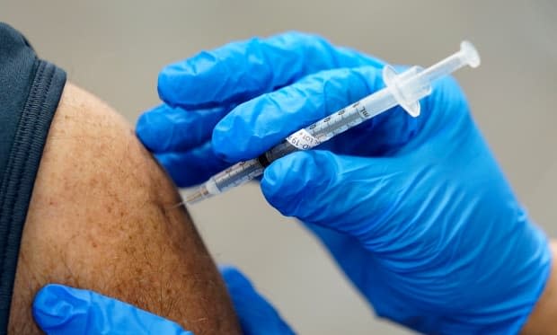 As of Friday, 58 per cent of Saskatchewan residents age 50 and over have received their first dose of a COVID-19 vaccine. (Paul Sancya/AP - image credit)