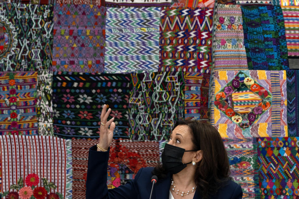 Vice President Kamala Harris gestures in front of traditional textiles as she attends a meeting with Guatemalan women entrepreneurs at the Universidad del Valle de Guatemala, in Guatemala City, Monday, June 7, 2021. (AP Photo/Jacquelyn Martin)