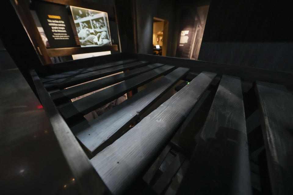 A recreation of bunks in a concentration camp is part of the new pavilion of the National World War II Museum, in New Orleans, Tuesday, Oct. 31, 2023. The latest major addition to the museum is called the Liberation Pavilion. And it's ambitious in scope. The grim yet hopeful addition addresses the conflict's world-shaping legacy. (AP Photo/Gerald Herbert)