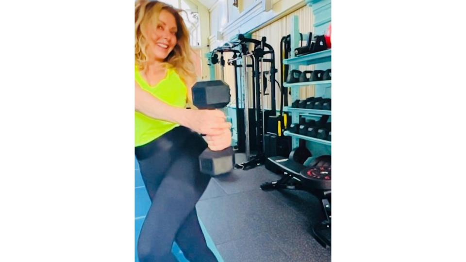 Carol Vorderman in the gym with a dumbbell