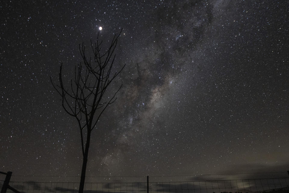 <p>RYLSTONE, AUSTRALIA - MAY 26: The supermoon is seen next to the milky way on May 26, 2021 in Rylstone, Australia. It is the first total lunar eclipse in more than two years, which coincides with a supermoon. A super moon is a name given to a full (or new) moon that occurs when the moon is in perigee - or closest to the earth - and it is the moon's proximity to earth that results in its brighter and bigger appearance. (Photo by Mark Evans/Getty Images)</p> 