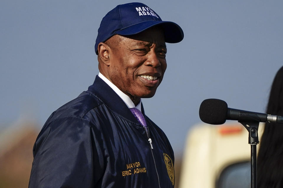 FILE — New York Mayor Eric Adams smiles while addressing athletes before they make their way onto the Verrazano Narrows Bridge at the start of the New York City Marathon, Nov. 5, 2023, in New York. FBI agents seized phones and an iPad from Adams this week as part of an investigation into his campaign finances, according to a published report, Friday, Nov. 10, 2023. (AP Photo/Frank Franklin II, File)