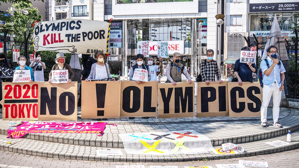 In this picture, protesters in Tokyo call on the Olympic Games to be cancelled. 