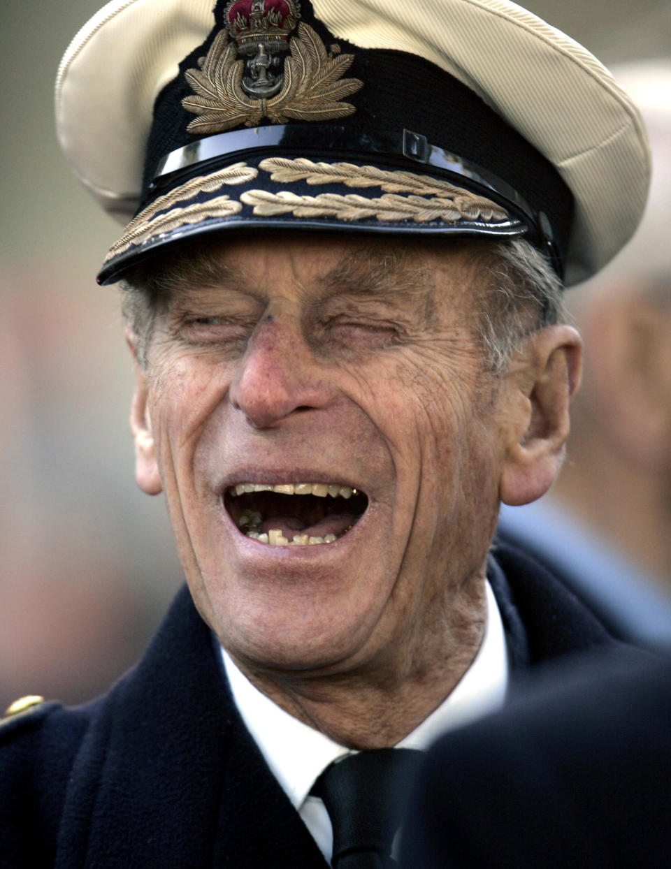 FILE - In this Nov. 9, 2006 file photo, Britain's Prince Philip shares a joke with a war veteran, following a ceremony for the Opening of the Field of Remembrance, on the grounds of the Westminster Abbey, in central London. Buckingham Palace says Prince Philip, husband of Queen Elizabeth II, has died aged 99. (AP Photo/Lefteris Pitarakis, File)