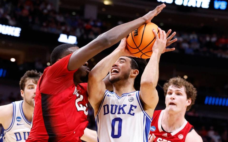 Duke’s Jared McCain (0) drives as N.C. State’s Mohamed Diarra (23) defends during the first half of N.C. State’s game against Duke in their NCAA Tournament Elite Eight matchup at the American Airlines Center in Dallas, Texas, Sunday, March 31, 2024.
