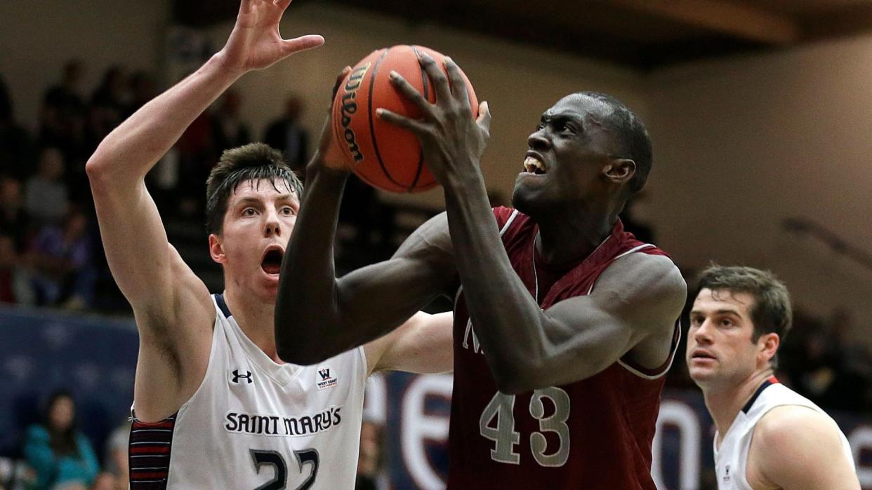 Mandatory Credit: Photo by Ben Margot/AP/Shutterstock (6046056h)Dane Pineau, Pascal Siakam New Mexico State's Pascal Siakam, right, looks to shoot against Saint Mary's Dane Pineau (22) during the second half of an NCAA college basketball game in the first round of the men's NIT, in Moraga, CalifNIT New Mexico St Saint Marys Basketball, Moraga, USA.