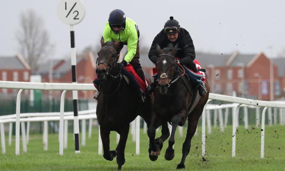 Epatante (left) and Altior on the gallops at Newbury.