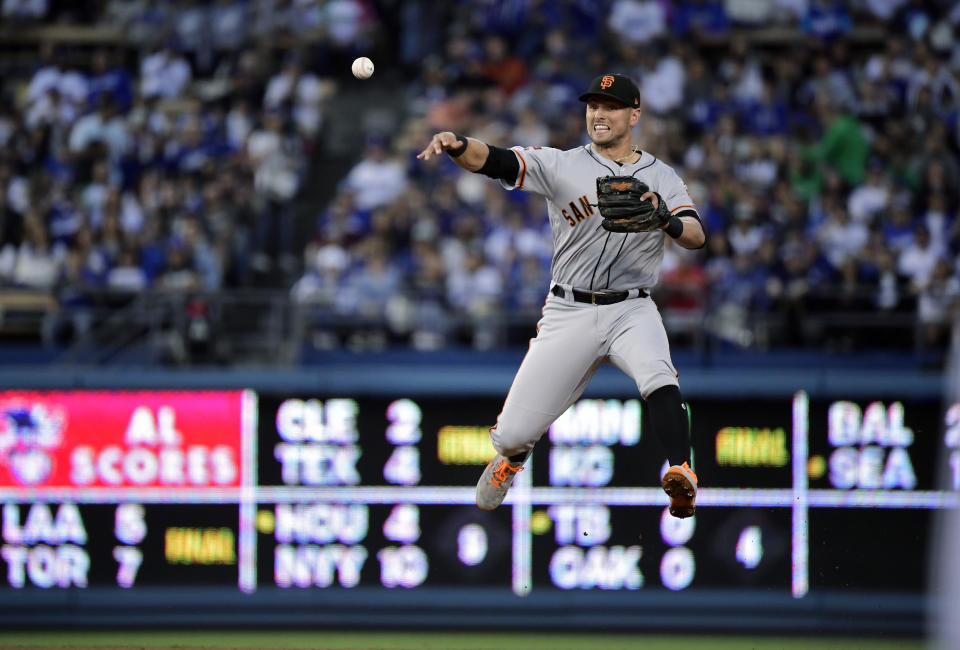 San Francisco Giants second baseman Joe Panik throws out Los Angeles Dodgers' Max Muncy at first during the third inning of a baseball game Thursday, June 20, 2019, in Los Angeles. (AP Photo/Mark J. Terrill)