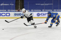 St. Louis Blues' Ryan O'Reilly (90) pressures Los Angeles Kings' Adrian Kempe (9) during the third period of an NHL hockey game Saturday, Jan. 23, 2021, in St. Louis. (AP Photo/Joe Puetz)