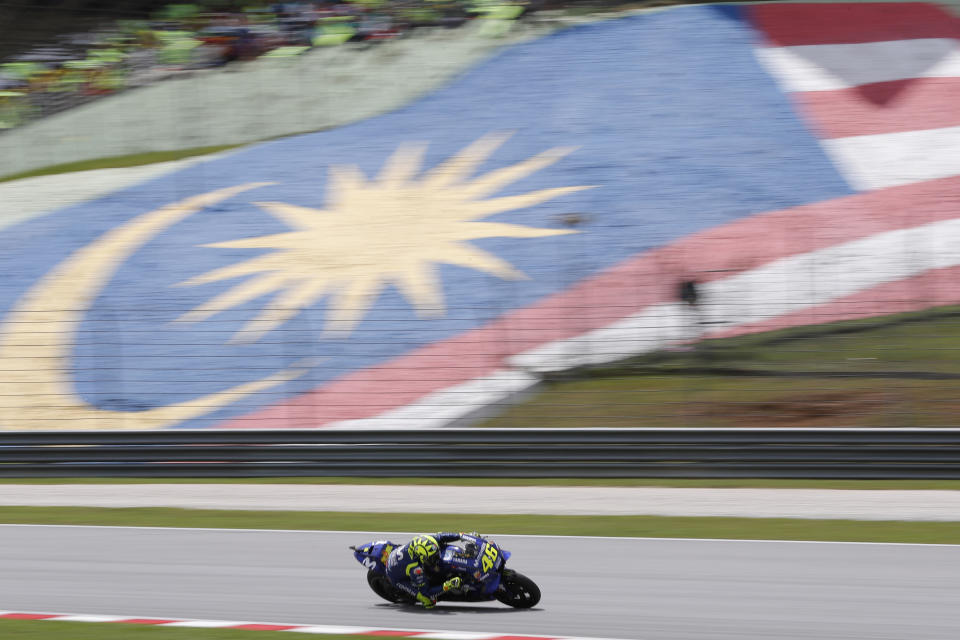 Yamaha rider Valentino Rossi of Italy powers his bike during Malaysia MotoGP at the Sepang International Circuit in Sepang, Malaysia, Sunday, Nov. 4, 2018. (AP Photo/Vincent Thian)