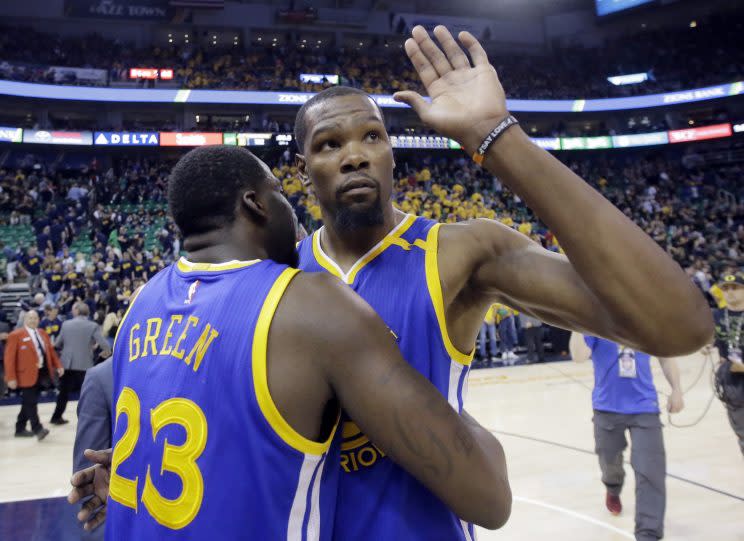 Golden State Warriors forward Kevin Durant waves goodbye to the Utah Jazz. (AP)