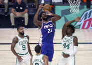 Boston Celtics center Robert Williams III (44) fouls Philadelphia 76ers center Joel Embiid (21) during the first half of Game 4 of an NBA basketball first-round playoff series, Sunday, Aug. 23, 2020, in Lake Buena Vista, Fla. (Kim Klement/Pool Photo via AP)