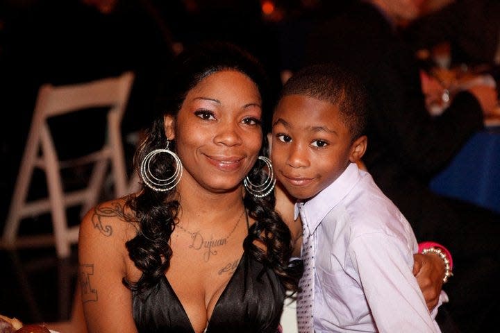 Dispatch Opinion Editor Amelia Robinson's cousin Tanisha Robinson with her son, Darryl Smith III, at Amelia Robinson's 2011 wedding in Columbus. Smith was shot and killed April 19, 2021. He was 17.