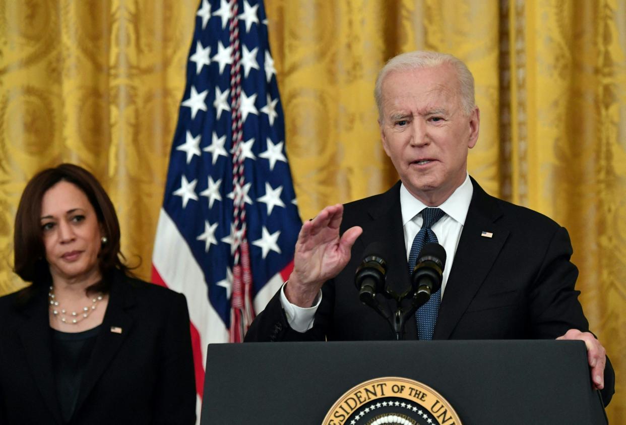 Vice President Kamala Harris listens as US President Joe Biden speaks before signing the Covid-19 Hate Crimes Act, in the East Room of the White House in Washington, DC on May 20, 2021. (Nicholas Kamm/AFP via Getty Images)