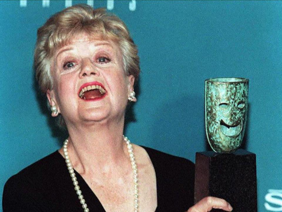 Angela Lansbury with her Lifetime Achievement Award given to her by the Screen Actors Guild in 1997 (AFP via Getty Images)